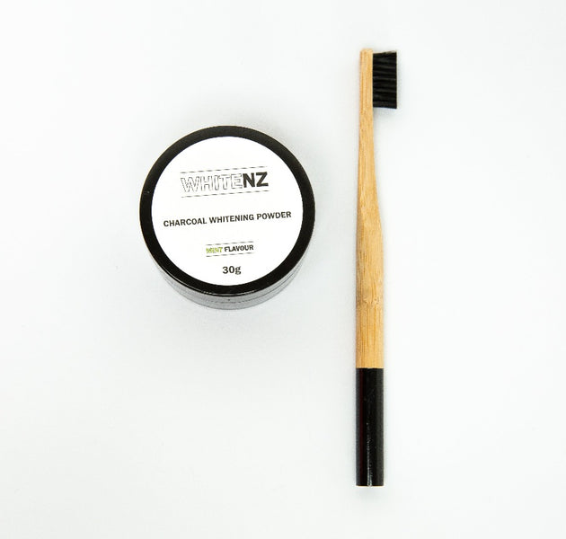 Charcoal teeth whitening powder and bamboo toothbrush
