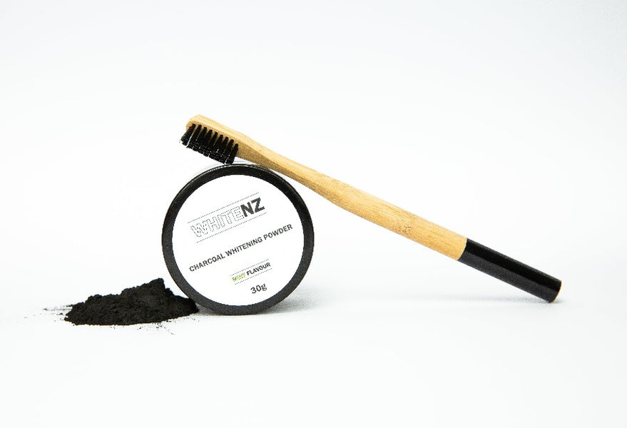 Charcoal teeth whitening powder and bamboo toothbrush
